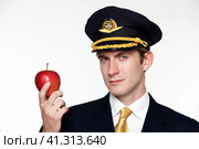 Young man in the form of a passenger plane pilot. Стоковое фото, фотограф Андрей Аркуша / Фотобанк Лори