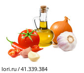 Bottle of olive oil, garlic, tomato, onion and chili pepper isolated on white background. Sauce ingredients. Стоковое фото, фотограф Катерина Ковалева / Фотобанк Лори
