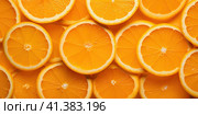 Sliced orange slices. Fruit background. Generated by AI. Стоковое AI-изображение, AI-художник Ярославский Максим / Фотобанк Лори