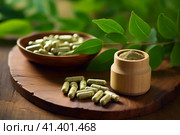 Wooden bowl of moringa capsules, powder and fresh leaves on the table. Superfood, dietary supplement. AI generated. Стоковое AI-изображение, AI-художник Александра Селина / Фотобанк Лори