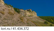 The remains of a medieval fortress city (according to other sources - a monastery) Tepe-Kermen, covering the upper part of the mountain in several tiers (2020 год). Стоковое фото, фотограф Анна Кривицкая / Фотобанк Лори