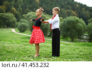 Childrens ballroom dance couple in suits. Стоковое фото, фотограф Андрей Аркуша / Фотобанк Лори