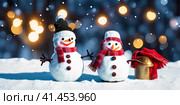 New Year's snowmen against bokeh lights. AI generated image. Стоковое AI-изображение, AI-художник Галина Царькова / Фотобанк Лори
