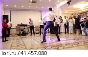 Nizhny Novgorod, Russia, Kazan highway 9, 08.31.2023. Armenian lezginka, A man dancing lezginka at a wedding banquet.  Нижний Новгород, Россия, Казанское шоссе, 9, 31.08.2023. Армянская лезгинка, мужчина танцует лезгинку на свадебном банкете. Редакционное видео, видеограф Egor Sarantstv / Фотобанк Лори