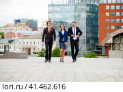 Business people walking outside office. Стоковое фото, фотограф Андрей Аркуша / Фотобанк Лори