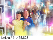 Grandson together with his grandfather solve the riddles of quest room. Стоковое фото, фотограф Яков Филимонов / Фотобанк Лори