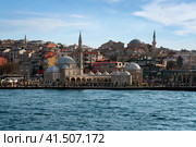 Istanbul, Turkey, 02.25.2023: View of the Uskyudar district in the Asian part of Istanbul and the Shemsi Ahmed Pasha Mosque from the Bosporus water area on a sunny day. Редакционное фото, фотограф Ula Ulachka / Фотобанк Лори