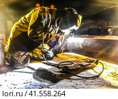 Safety at work. Welding and installation of the pipeline. Industrial weekdays welders and fitters. Стоковое фото, фотограф Леонид Еремейчук / Фотобанк Лори