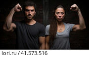 A man and a woman are fighting for their rights. Стоковое AI-изображение, AI-художник Кирилл Черезов / Фотобанк Лори