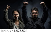 A man and a woman are fighting for their rights. Стоковое AI-изображение, AI-художник Кирилл Черезов / Фотобанк Лори