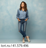 A young smiling confident pretty attractive European girl of 20 years old in a gray casual T-shirt, looking away, isolated on a white background Created by AI. Стоковое AI-изображение, AI-художник Ярославский Максим / Фотобанк Лори