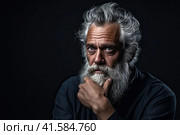 Portrait of an elderly man with a large gray beard and lush hair on his head with a thoughtful look. Dark background.Generated by AI. Стоковое AI-изображение, AI-художник Ярославский Максим / Фотобанк Лори