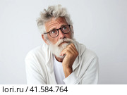 Portrait of an elderly man with a large gray beard and lush hair on his head with a thoughtful look. White background. Generated by AI. Стоковое AI-изображение, AI-художник Ярославский Максим / Фотобанк Лори