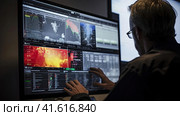 A meteorologist analyzes weather information. Стоковое AI-изображение, AI-художник Кирилл Черезов / Фотобанк Лори