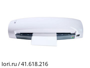A machine for laminating photos and documents with plastic, isolated on white background. Desktop white laminator, close-up. Стоковое фото, фотограф Андрей Журавлев / Фотобанк Лори