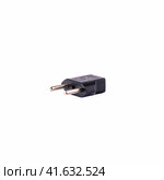 2-pin EU to US plug type Converter black Plastic element isolated on a white background. Close up. Стоковое фото, фотограф Воловодов Владимир / Фотобанк Лори