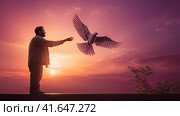 A man and a pigeon in flight against the background of the setting sun.Generated by AI. Стоковое AI-изображение, AI-художник Ярославский Максим / Фотобанк Лори