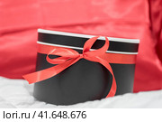 gift surprise box with red ribbon. Стоковое фото, фотограф Артем Курутин / Фотобанк Лори