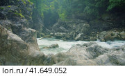 Evaporation over a cold mountain river with clear water in rocky gorge. Spring nature landscape. Стоковое видео, видеограф Ольга Сухарева / Фотобанк Лори