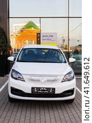 EV car Aeolus E70 also called Evolute i-Pro parked in front of dealership, front view. Редакционное фото, фотограф Константин Григорьев / Фотобанк Лори