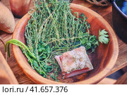 With a piece of bacon in the bowl with the herb and seasoning. The food of the first American settlers in the wild West and gold miners. Стоковое фото, фотограф Андрей Журавлев / Фотобанк Лори