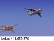 Moscow / Russia - 05 09 2014: The group of supersonic strategic bomber of long-range aviation Tu-160 and flying tanker Il-78m fly over the Red Square. Редакционное фото, фотограф Андрей Журавлев / Фотобанк Лори