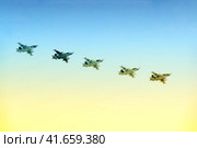 Moscow / Russia - 05 09 2014: aircraft group flying in the blue sky, close-up. Редакционное фото, фотограф Андрей Журавлев / Фотобанк Лори