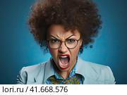 A woman in a state of extreme rage, with clenched fists and jaw, angry, emotional and furious, is singled out for office. Generated by AI. Стоковое AI-изображение, AI-художник Ярославский Максим / Фотобанк Лори