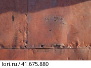Old rusted metal texture. The surface of an uneven iron wall. Perfect for background and grunge design. Стоковое фото, фотограф Андрей Степанов / Фотобанк Лори