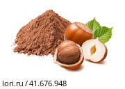 Hazelnuts and pile of cocoa powder isolated on white background. Стоковое фото, фотограф Катерина Ковалева / Фотобанк Лори