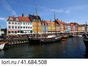 Copenhagen, Denmark - 28 Jun 2012: Nyhavn canal in Copenhagen, Denmark. Редакционное фото, фотограф Сергей Стрелков / Фотобанк Лори