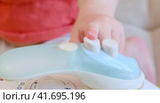 Hot iron accident serves as a reminder of the dangers lurking in every home. Kid aged about two years (one year ten months). Стоковое видео, видеограф Андрей Журавлев / Фотобанк Лори