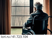 Senior man disabled sitting alone in wheelchair looking through window at hospital, lonely elder thoughtful sad old man look outside in bedroom at retirement home, feel depressed lonely. AI. Стоковое AI-изображение, AI-художник Sergey Grishin / Фотобанк Лори