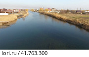 River eric current in the village in the spring. Shallow river, slowly flowing in the village. Стоковое фото, фотограф Леонид Еремейчук / Фотобанк Лори