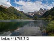 View of Lake Tumanly-Gel (Foggy Lake) in the valley of the Gonachkhir River on the territory of the Teberdinsky National Park on a sunny summer day, Dombay, Karachay-Cherkessia, Russia. Стоковое фото, фотограф Ula Ulachka / Фотобанк Лори