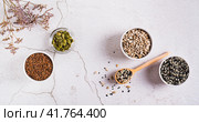Pumpkin, flax, sesame and sunflover seeds cycling for hormone balance top view web banner. Стоковое фото, фотограф Елена Руй / Фотобанк Лори