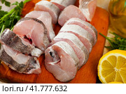 Raw haddock on wooden table. Стоковое фото, фотограф Яков Филимонов / Фотобанк Лори