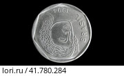 Аверс монеты Бразилии 1994 года с портретом античного юноши, черный фон. Obverse of Brazil small coin from 1994, isolated in white background. Close up view. Стоковая анимация, аниматор Александр Кузнецов / Фотобанк Лори