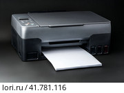 Modern laser printer on black background close up. Стоковое фото, фотограф Сергей Толмачёв / Фотобанк Лори