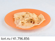 Missing first pancake on a plate. The first pancake is lumpy. Стоковое фото, фотограф Сергей Долгов / Фотобанк Лори