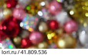 Christmas Ornaments Defocused Background Rotation. Close up a Glitter Christmas Tree Decoration Items Turning. Blurred Backdrop New Year Ornate. Many Shiny Xmas Bauble, Balls and Bulbs Bokeh. Top View. Стоковое видео, видеограф Марина Демидюк / Фотобанк Лори