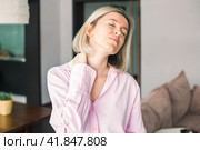 Woman have pain in neck or shoulder. Стоковое фото, фотограф Гладских Татьяна / Фотобанк Лори