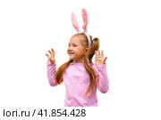 A funny laughing child in the guise of a rabbit on white bacground. The year according to the zodiac sign of the Eastern calendar. Easter Greeting poster. Стоковое фото, фотограф Ирина Старикова / Фотобанк Лори