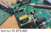 Close up Soldering a micro chip processor with iron tool on a green circuit boad. Electroncs service technology and macro computer concept background. Стоковое видео, видеограф Ирина Старикова / Фотобанк Лори