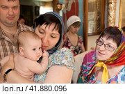 Russia Samara June 25, 2011: Orthodox parishioners came to baptize their babies in the church. Редакционное фото, фотограф Акиньшин Владимир / Фотобанк Лори