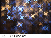 Abstract fuzzy dark background with golden and blue four-pointed stars. Стоковое фото, фотограф Светлана Ильева (Иванова) / Фотобанк Лори