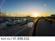 PLAYA BLANCA, LANZAROTE - OCTOBER 25, 2023: Sunset on Marina Rubicon of Playa Blanca. Lens flare. Playa Blanca is the southernmost town of the Spanish island of Lanzarote. Редакционное фото, фотограф Sergey Kohl / Фотобанк Лори