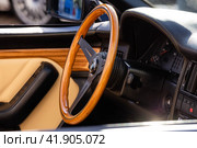 Wooden steering wheel in car. Car interior with dashboard, speedometer and tachometer. Стоковое фото, фотограф Константин Григорьев / Фотобанк Лори