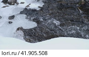 Video of Stones with snow caps and ice in the water of frozen river Pescherka near waterfall in winter season. Russia. Стоковое видео, видеограф Сергей Пристяжнюк (Serg Zastavkin) / Фотобанк Лори