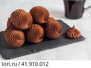 marshmallow in chocolate or marshmallow with a cup of coffee on a gray background of concrete and linen fabric. side view. Стоковое фото, фотограф Ирина Ручушкина / Фотобанк Лори